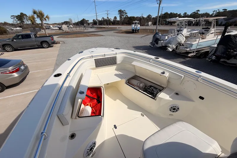 Slide: The Image of 2024 Cobia 262 Center Console boat interior with storage compartments and seating. - 38