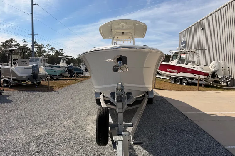 Slide: The Image of 2024 Cobia 262 Center Console boat on trailer at dealership. - 7