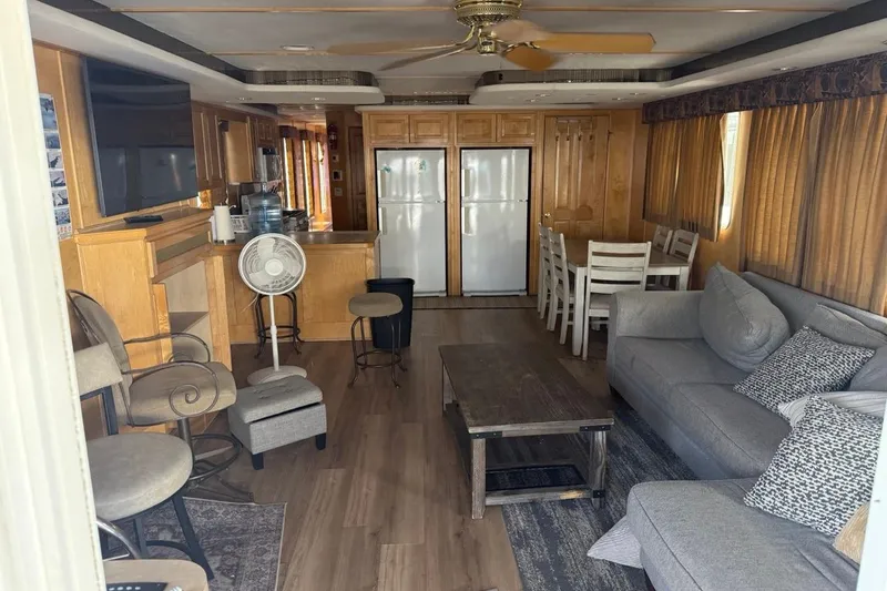 Slide: The Image of Interior of 2004 Sharpe Houseboat, San Juan Sunrise Share #30, featuring cozy seating and dining area. - 7