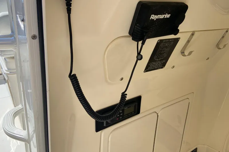 Slide: The Image of 2011 Boston Whaler 320 Outrage interior with Raymarine equipment and hooks. - 18