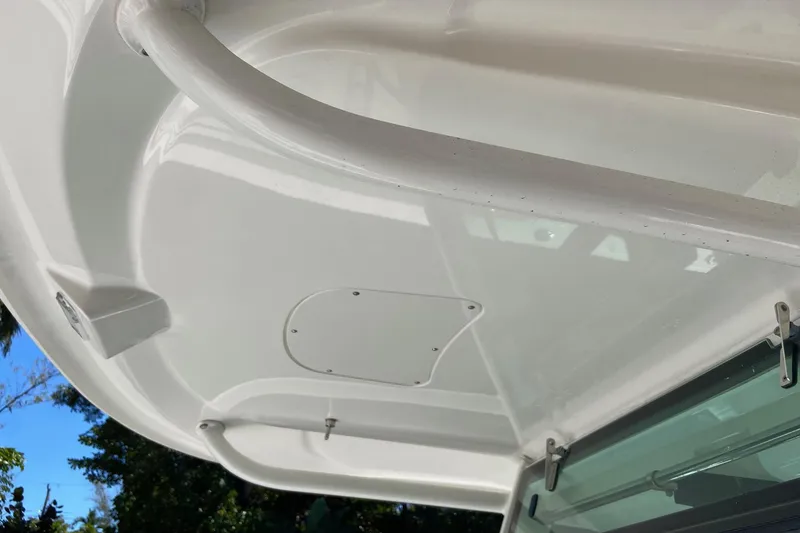 Slide: The Image of 2011 Boston Whaler 320 Outrage boat canopy detail with clear sky background. - 26