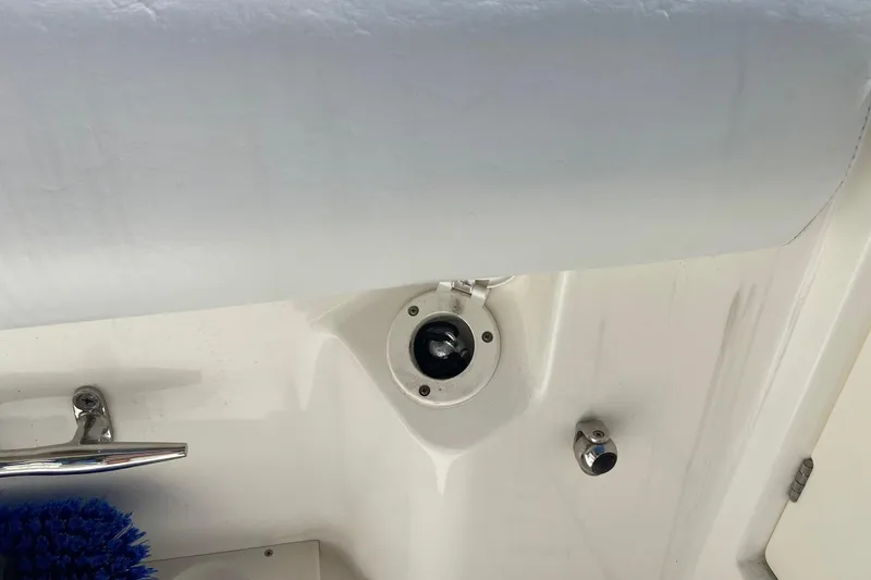 Slide: The Image of 2011 Boston Whaler 320 Outrage boat interior detail with brush and fittings. - 30