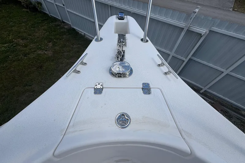 Slide: The Image of Bow of 2001 Cobia 254 Center Console with anchor and hatch details. - 10