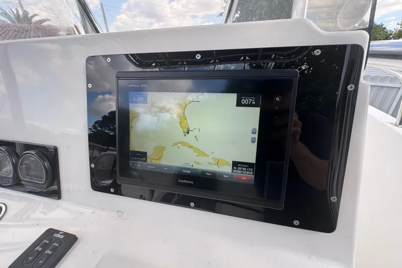 Slide: The Image of Garmin GPS display on 2001 Cobia 254 Center Console boat dashboard. - 22