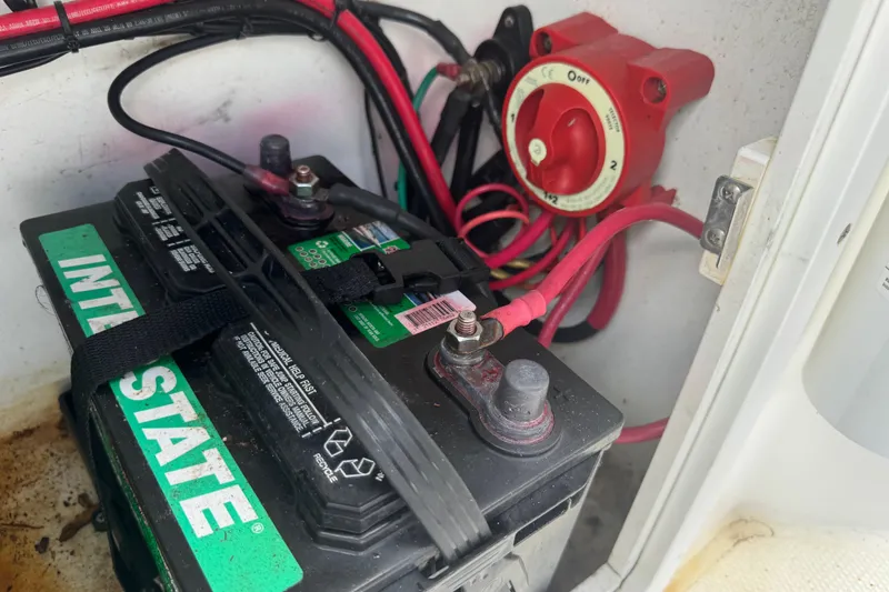 Slide: The Image of Battery and wiring setup in a 2001 Cobia 254 Center Console boat. - 39