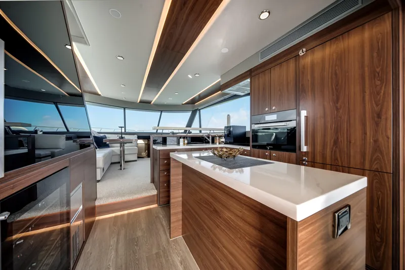 Slide: The Image of Luxurious interior of 2024 Maritimo M55 yacht with modern kitchen and panoramic windows. - 12