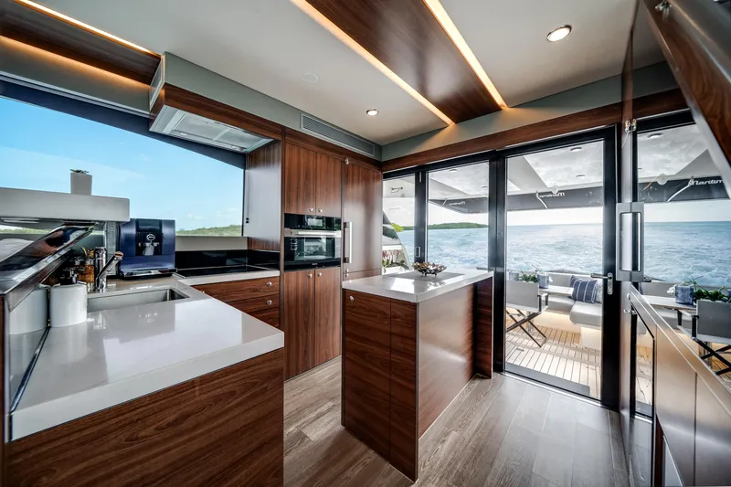 Slide: The Image of Luxurious 2024 Maritimo M55 yacht interior with modern kitchen and ocean view. - 13