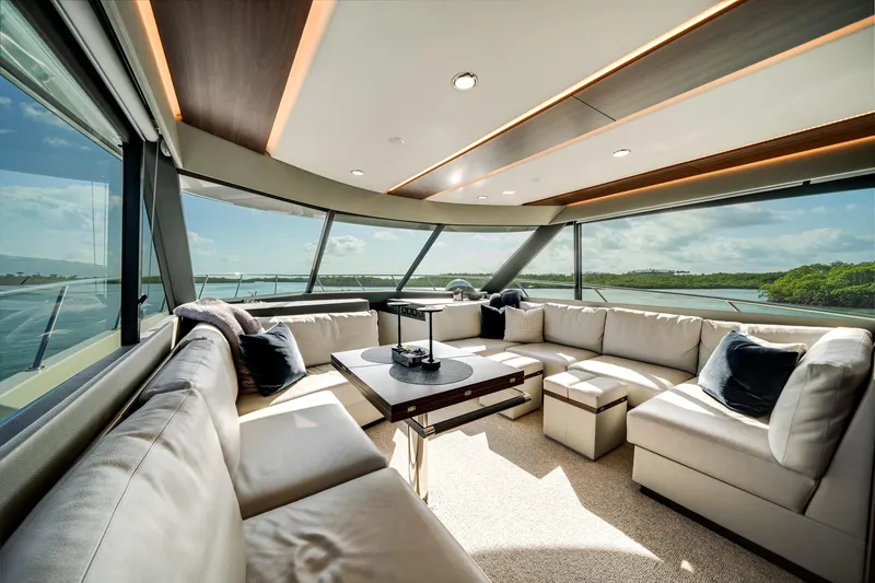 Slide: The Image of Luxurious interior of 2024 Maritimo M55 yacht with panoramic windows and plush seating. - 17