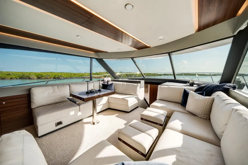 Slide: The Image of Luxurious interior of 2024 Maritimo M55 yacht with panoramic windows and plush seating. - 19