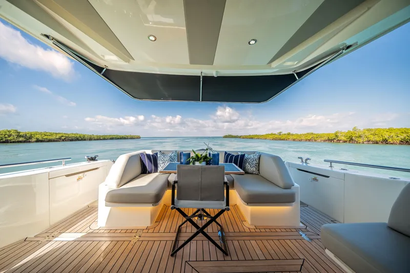 Slide: The Image of 2024 Maritimo M55 yacht deck with luxurious seating and scenic ocean view. - 20