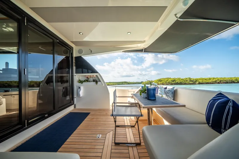 Slide: The Image of Luxurious 2024 Maritimo M55 yacht interior with elegant seating and scenic ocean view. - 21