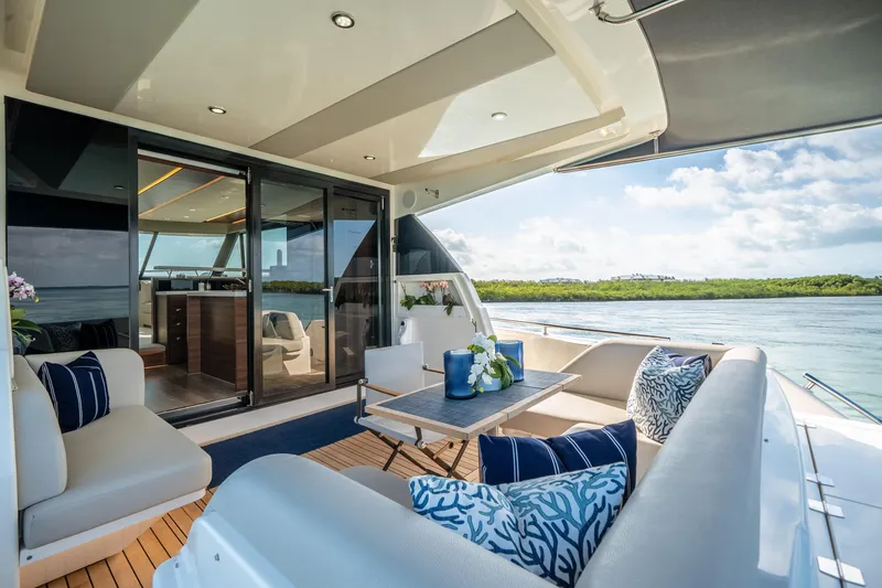 Slide: The Image of Luxurious 2024 Maritimo M55 yacht interior with elegant seating and scenic ocean view. - 22