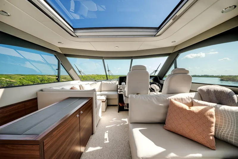 Slide: The Image of Luxurious interior of 2024 Maritimo M55 yacht with panoramic windows and plush seating. - 26