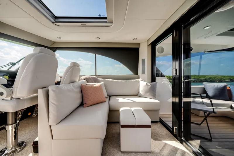 Slide: The Image of Luxurious interior of 2024 Maritimo M55 yacht with plush seating and panoramic views. - 27