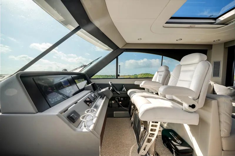Slide: The Image of 2024 Maritimo M55 yacht interior with modern helm and luxurious seating. - 31