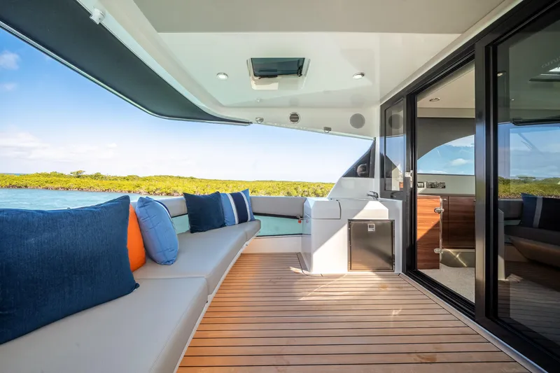 Slide: The Image of Luxurious 2024 Maritimo M55 yacht deck with plush seating and scenic ocean view. - 33