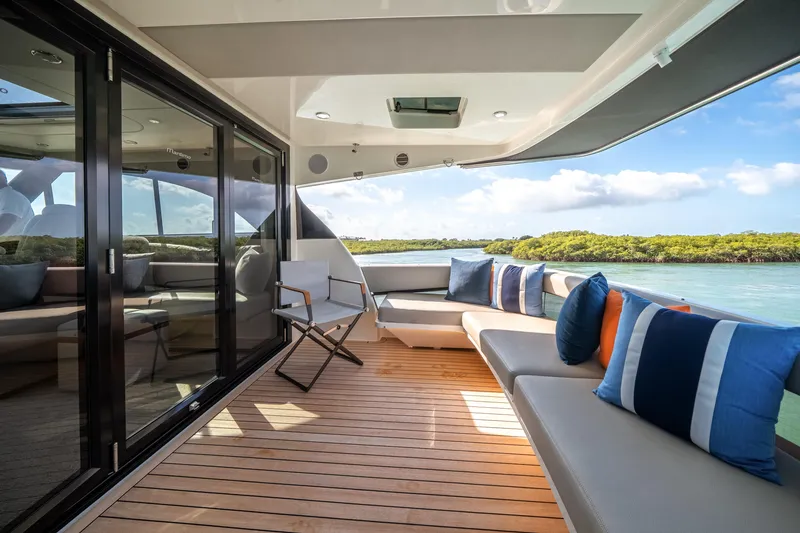 Slide: The Image of Luxurious 2024 Maritimo M55 yacht deck with elegant seating and scenic water view. - 34