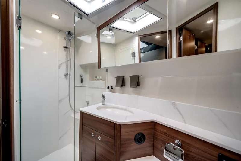 Slide: The Image of Luxurious bathroom in 2024 Maritimo M55 yacht with modern fixtures and elegant design. - 38