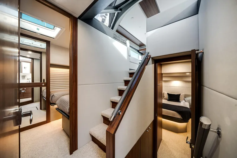 Slide: The Image of Luxurious interior of 2024 Maritimo M55 yacht with elegant bedrooms and staircase. - 42
