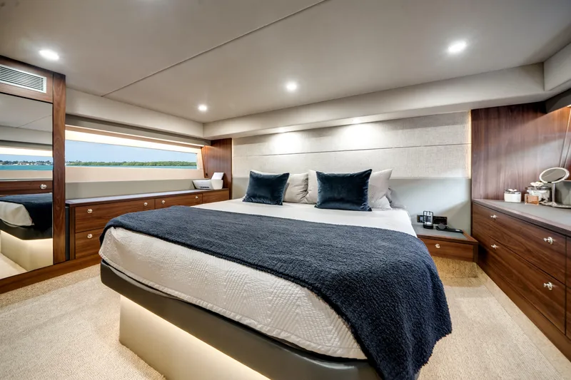 Slide: The Image of Luxurious 2024 Maritimo M55 yacht bedroom with elegant wood finishes and modern decor. - 43