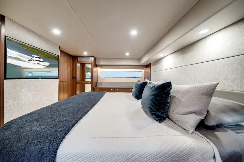 Slide: The Image of Luxurious 2024 Maritimo M55 yacht bedroom with elegant decor and modern amenities. - 44