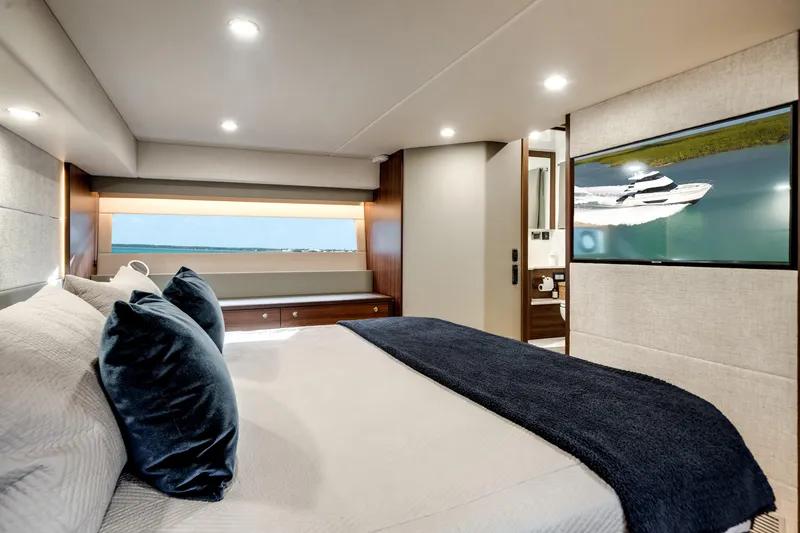 Slide: The Image of Luxurious bedroom interior of 2024 Maritimo M55 yacht with modern decor and large window view. - 46