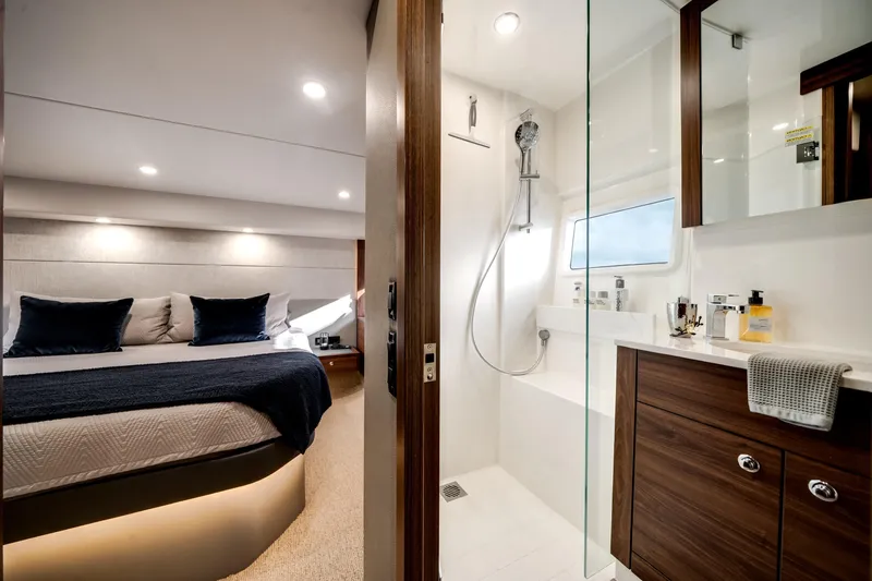 Slide: The Image of Luxurious interior of 2024 Maritimo M55 yacht featuring bedroom and modern bathroom. - 49