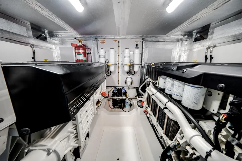Slide: The Image of Engine room of 2024 Maritimo M55 yacht, featuring advanced machinery and equipment. - 54