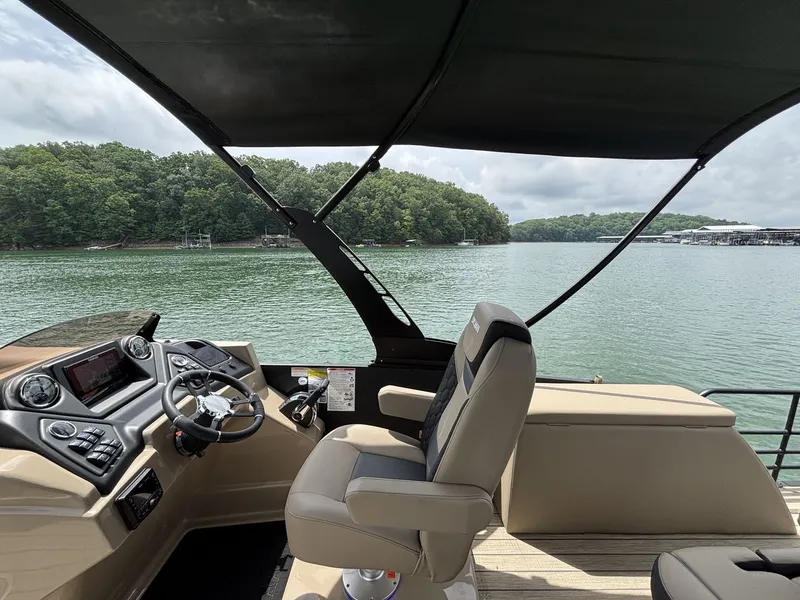 Slide: The Image of Interior of a 2026 Sylvan L5 CLZ DH boat on a lake. - 5