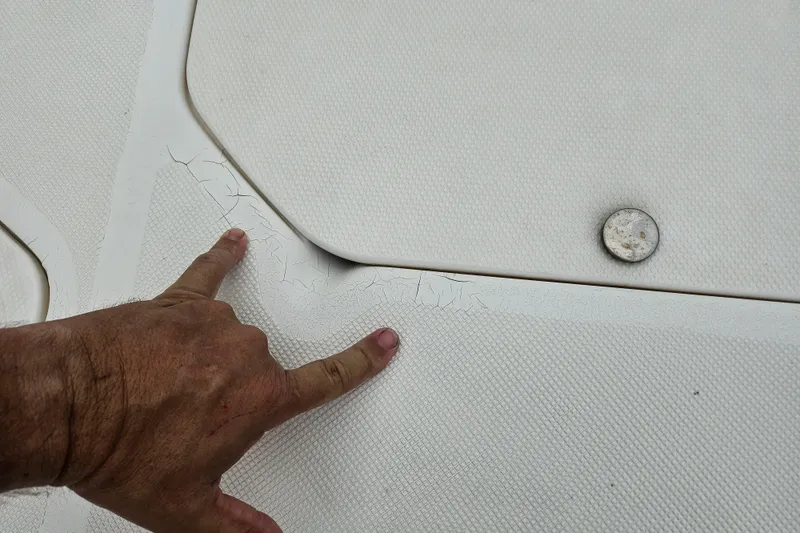 Slide: The Image of Close-up of 2006 Hurricane SunDeck 237 OB deck showing surface cracks. - 14