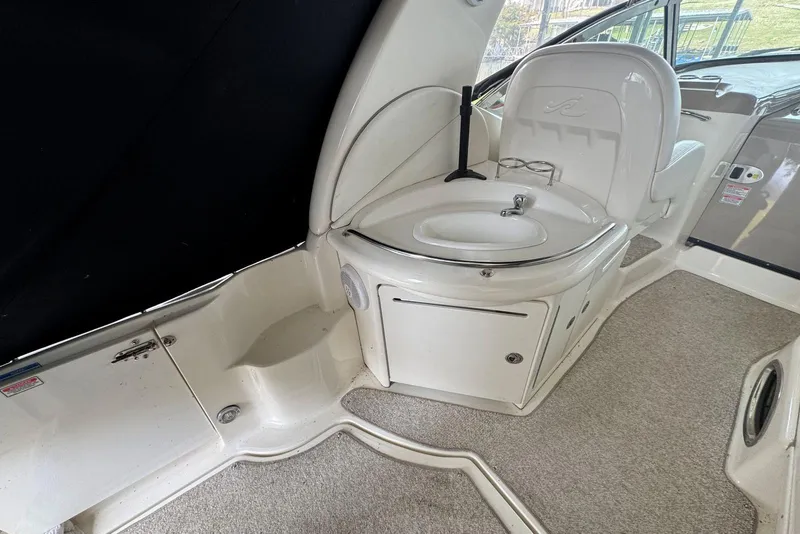 Slide: The Image of 2005 Sea Ray 340 Sundancer interior with sink and seating area. - 11
