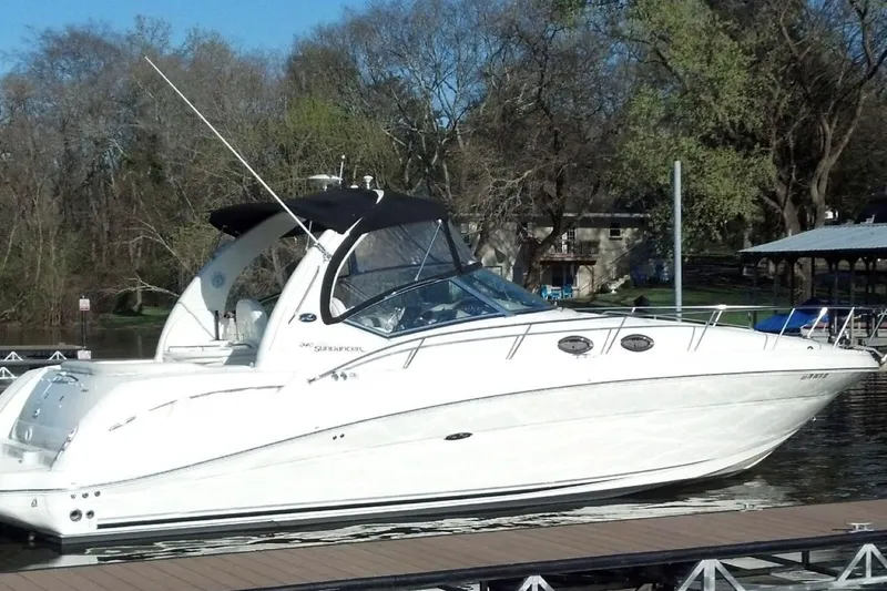 Slide: The Image of 2005 Sea Ray 340 Sundancer yacht docked on a calm lake. - 3