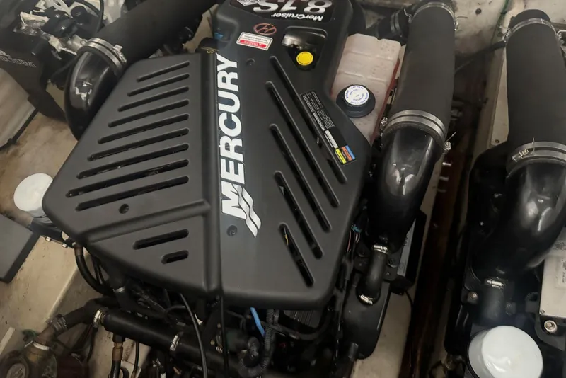 Slide: The Image of Engine of 2005 Sea Ray 340 Sundancer with Mercury branding visible. - 43