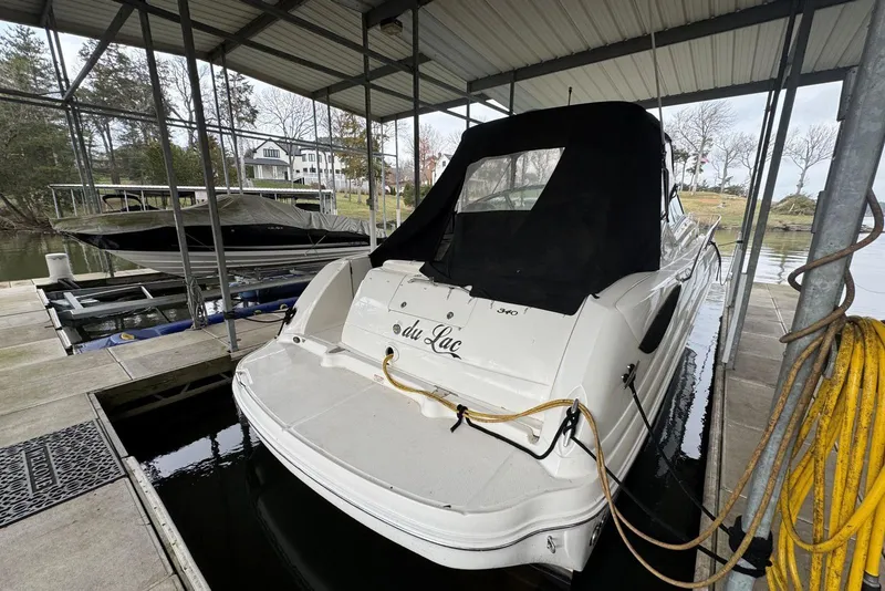 Slide: The Image of 2005 Sea Ray 340 Sundancer docked under a covered marina slip. - 6
