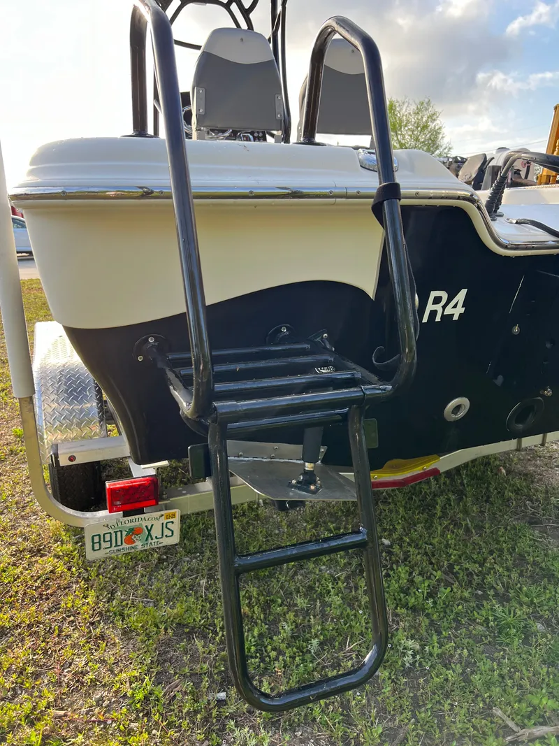 Slide: The Image of 2016 Blue Wave 2400 PureBay boat with ladder. - 10