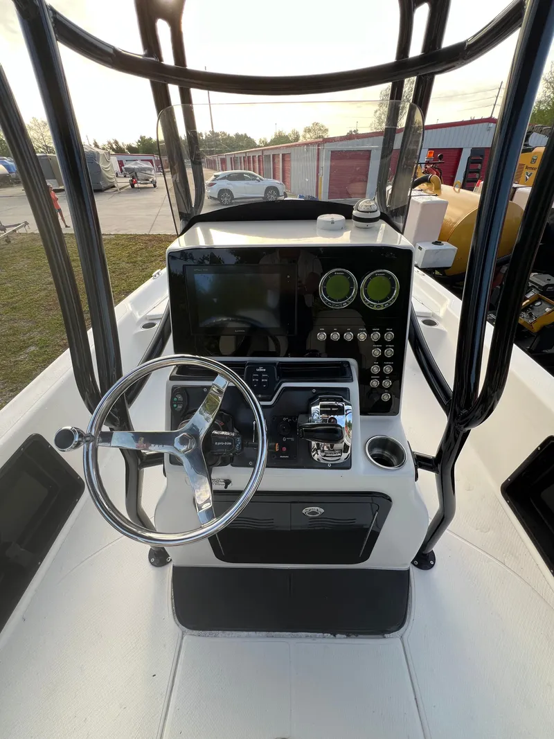 Slide: The Image of Helm console of a 2016 Blue Wave 2400 PureBay boat. - 24