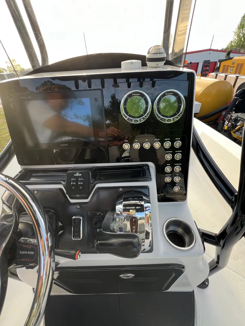 Slide: The Image of Control console of a 2016 Blue Wave 2400 PureBay boat. - 26