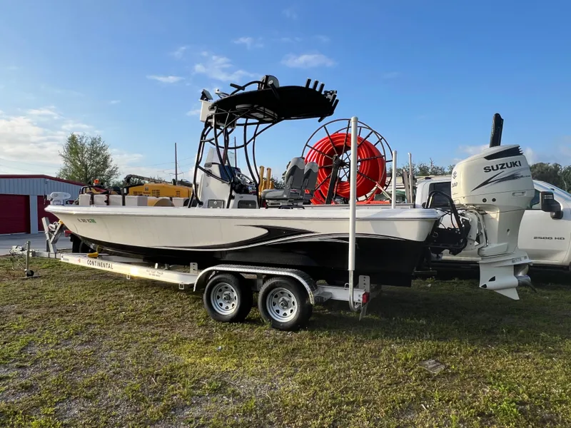 Slide: The Image of 2016 Blue Wave 2400 PureBay boat on trailer with Suzuki engine. - 3