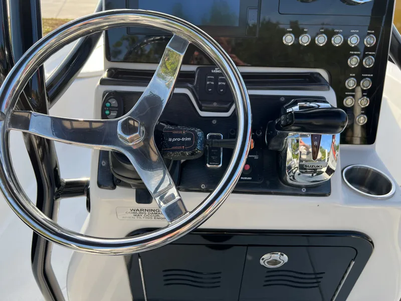 Slide: The Image of Steering console of a 2016 Blue Wave 2400 PureBay boat. - 30