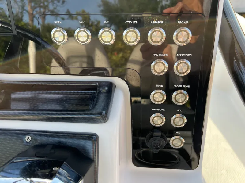 Slide: The Image of Control panel of a 2016 Blue Wave 2400 PureBay boat. - 33