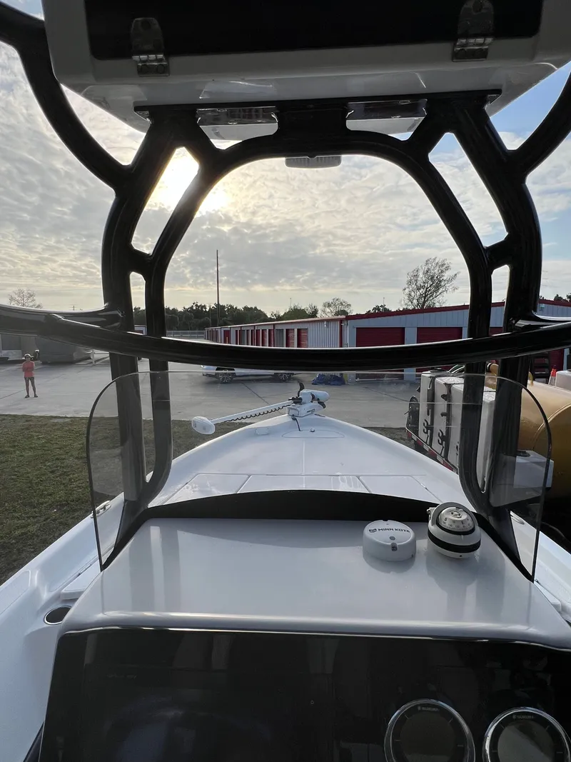 Slide: The Image of Interior view of a 2016 Blue Wave 2400 PureBay boat at sunset. - 35