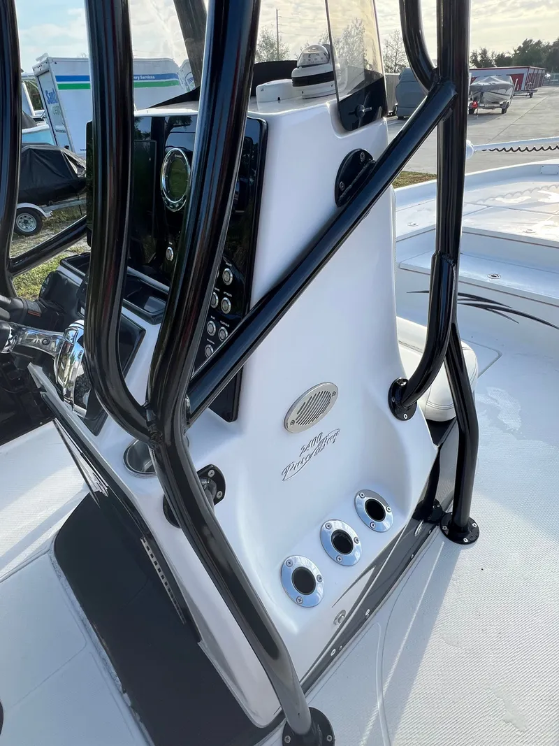 Slide: The Image of 2016 Blue Wave 2400 PureBay boat console with controls. - 42