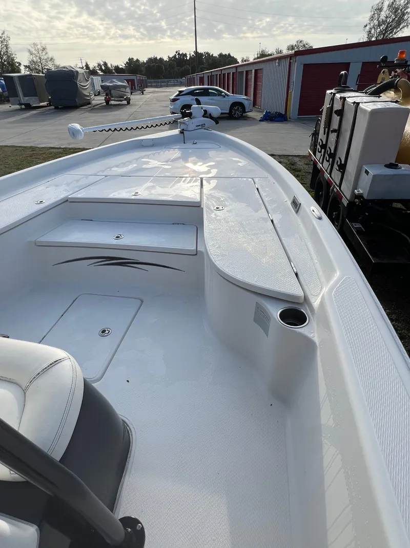 Slide: The Image of 2016 Blue Wave 2400 PureBay boat on parking lot. - 44