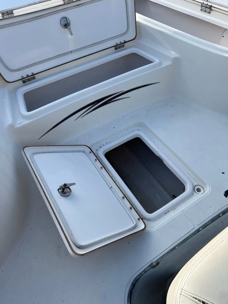 Slide: The Image of 2016 Blue Wave 2400 PureBay boat with open storage compartments. - 49