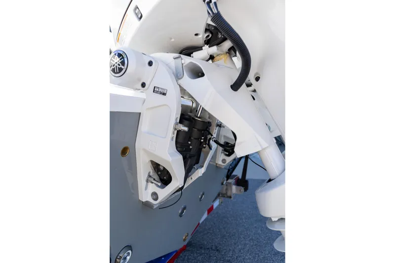 Slide: The Image of Close-up of 2026 Sportsman Open 252 Center Console boat engine components. - 12