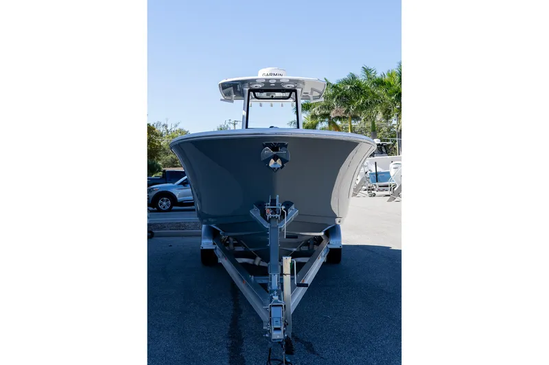Slide: The Image of 2026 Sportsman Open 252 Center Console boat on trailer, parked outdoors. - 13