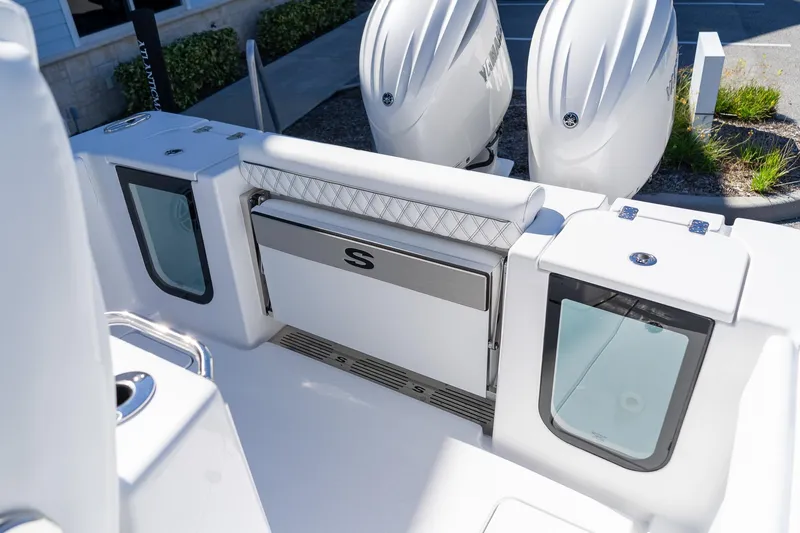 Slide: The Image of 2026 Sportsman Open 252 Center Console boat interior with dual engines and seating. - 14