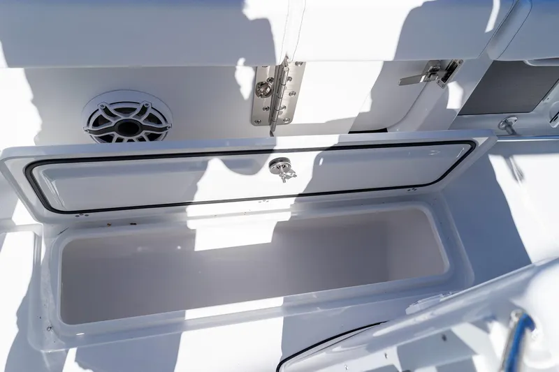 Slide: The Image of Open storage compartment on 2026 Sportsman Open 252 Center Console boat. - 27