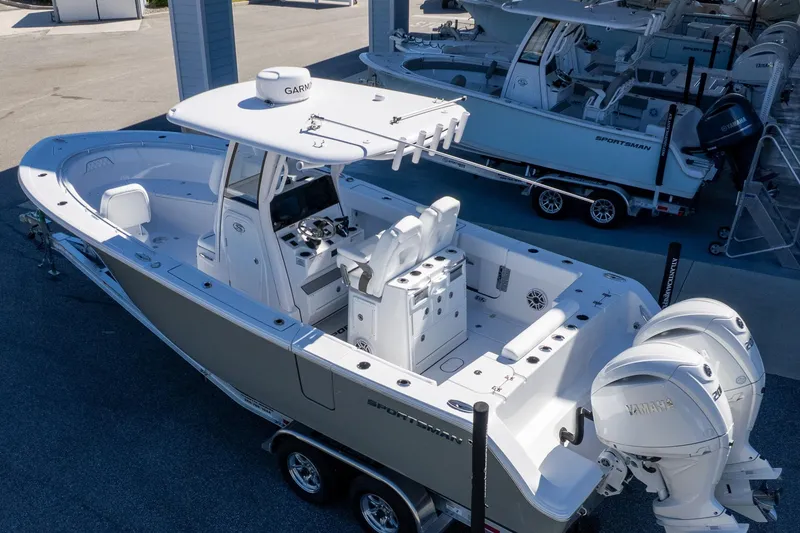 Slide: The Image of 2026 Sportsman Open 252 Center Console boat with dual engines on a trailer. - 3