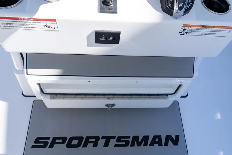 Slide: The Image of 2026 Sportsman Open 252 Center Console boat interior with branded mat and control panel. - 30